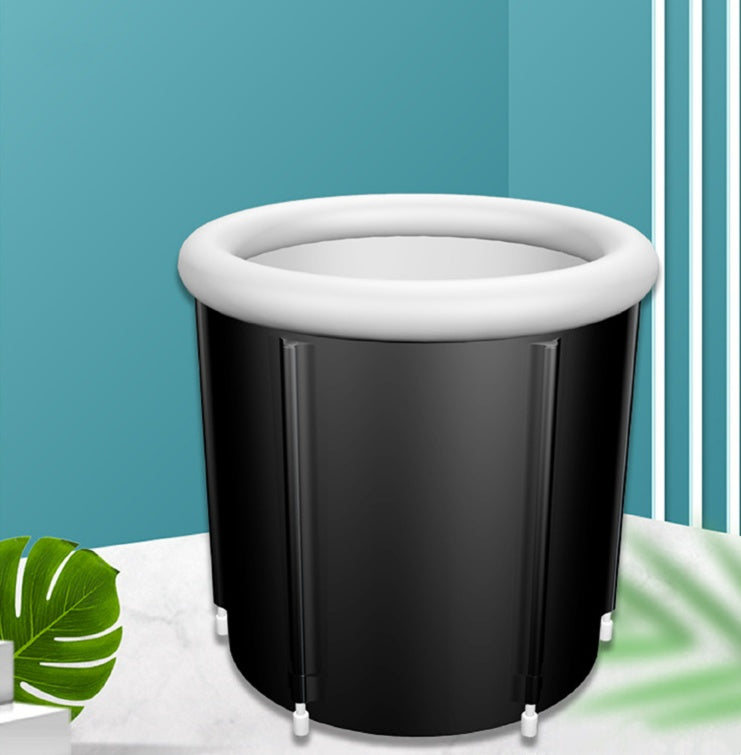 Black inflatable bathtub with white rim on a blue background